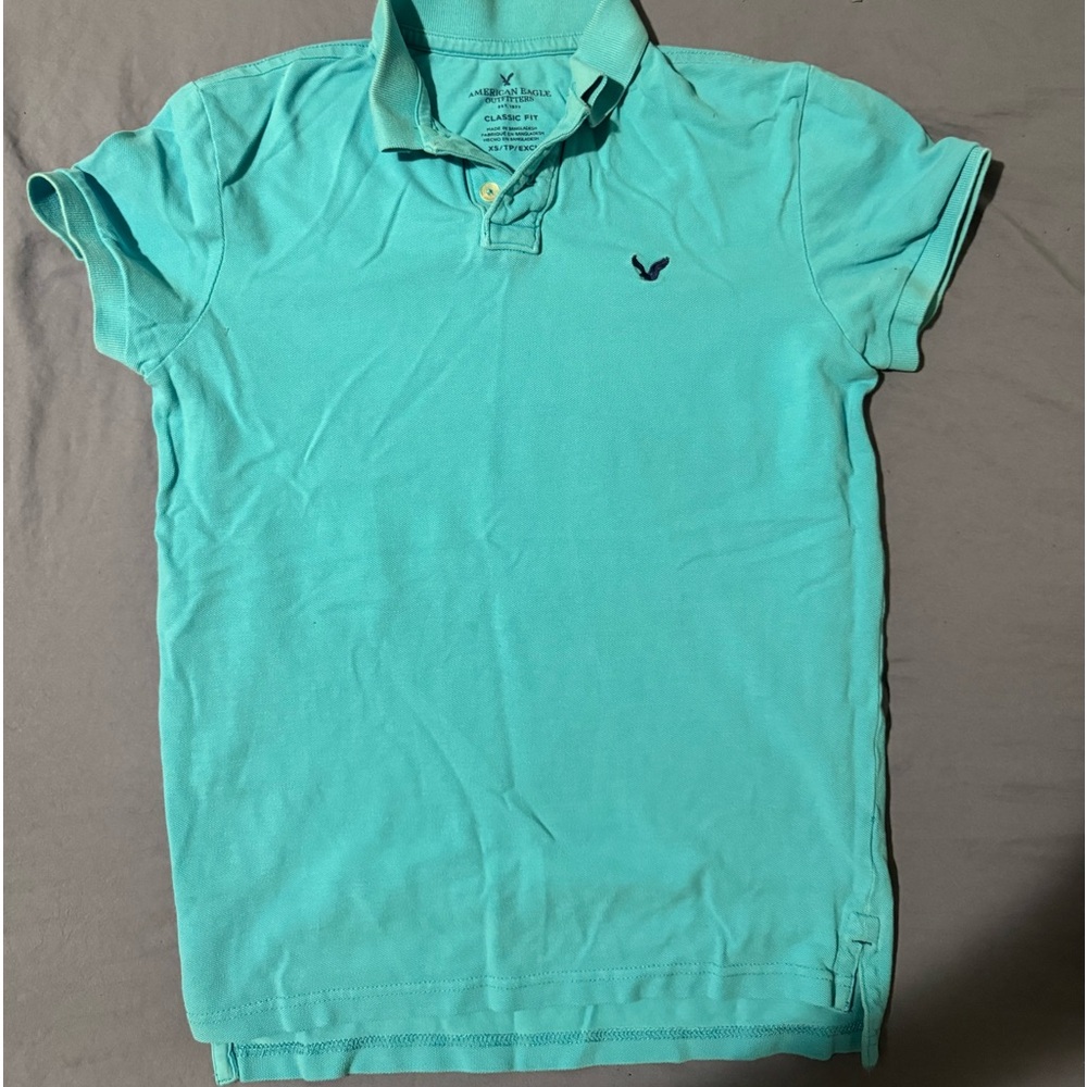Light blue American eagle polo shirt.